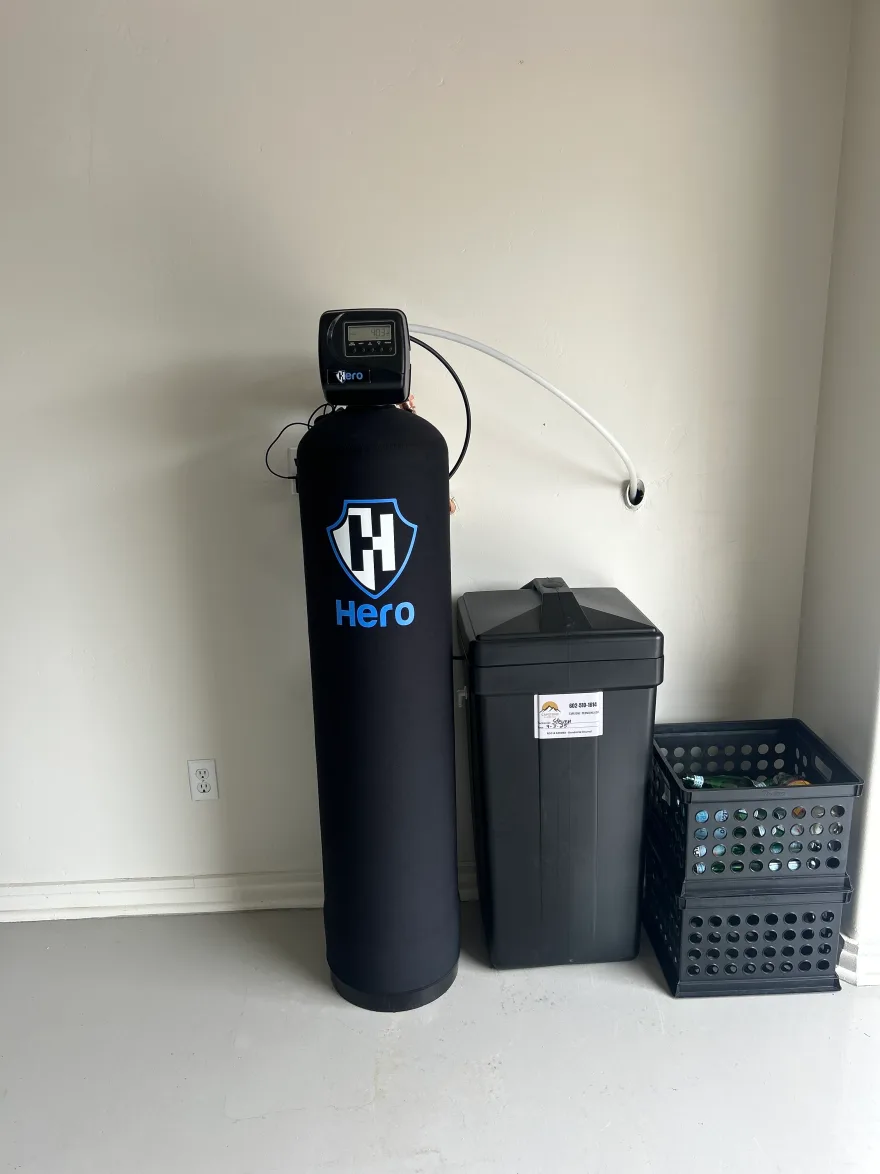 Hero whole-home water softener installed by Capstone Plumbing, with a digital metered control valve on the resin tank and a brine tank alongside, Cave Creek AZ