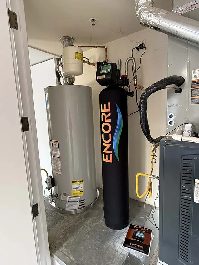 Gas tank water heater with expansion tank and water treatment system installed by Capstone Plumbing in Cave Creek, AZ